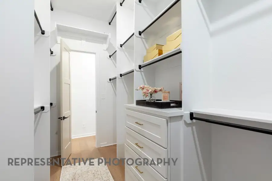 Spacious closet featuring wood finished floors