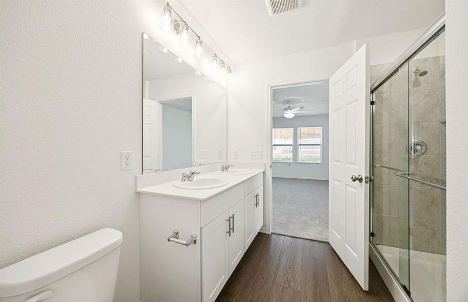 Owner's private bath complete with double sinks and a generous shower Owner's private bath complete with double sinks and a generous shower