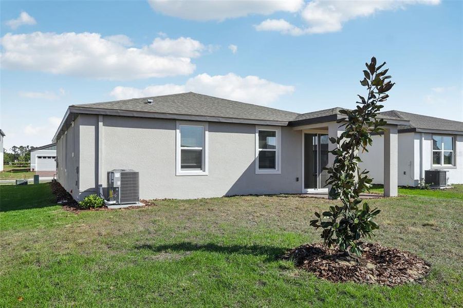 Front exterior of a new home in Springs at Lake Alfred - Signature Series, Lake Alfred, FL, highlighting curb appeal (Image 1).