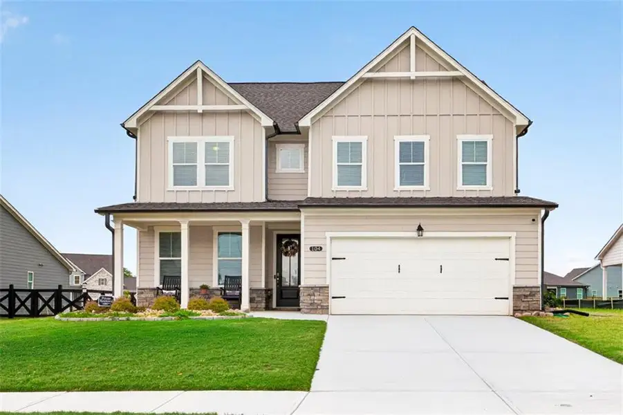 Front exterior of a new home in , Hoschton, GA, highlighting curb appeal (Image 1). Front exterior of a new home in , Hoschton, GA, highlighting curb appeal (Image 1).