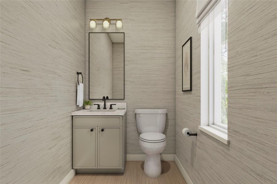 Half bathroom featuring vanity and tile walls