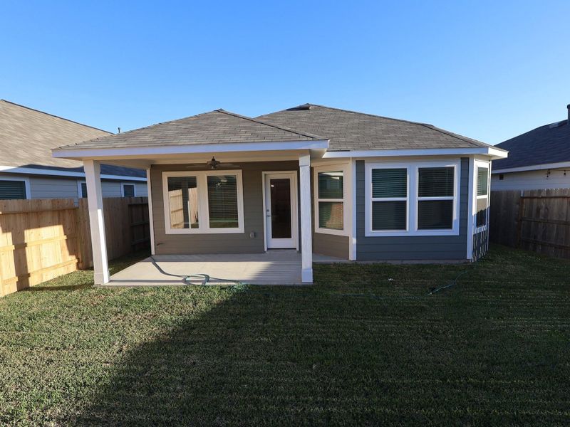 Exterior details and patio area of a home in Pinewood at Grand Texas, New Caney (Image 20).