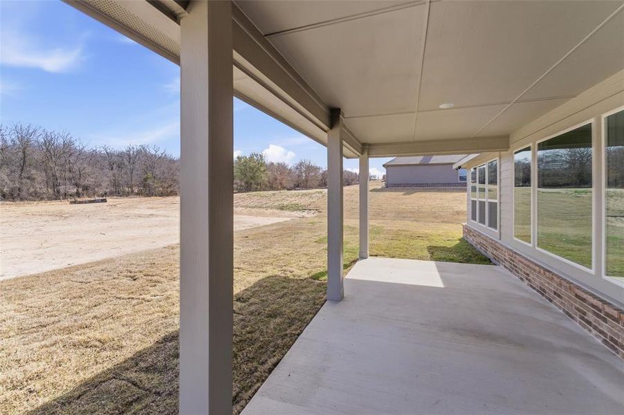 Exterior details and patio area of a home in Oak Grove Addition, Springtown (Image 3).