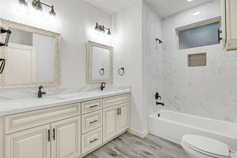 Secondary bathroom with double sinks Secondary bathroom with double sinks