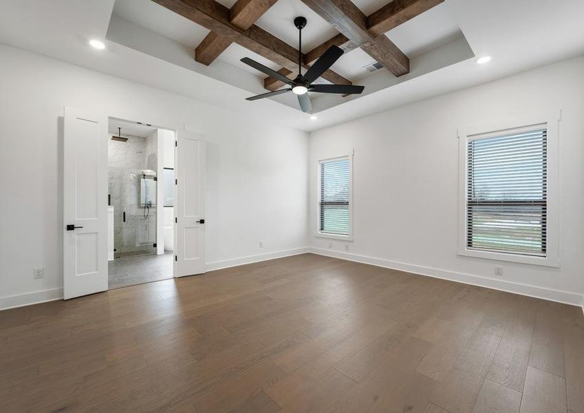 The peaceful master bedroom has two large windows that let in great, natural light.