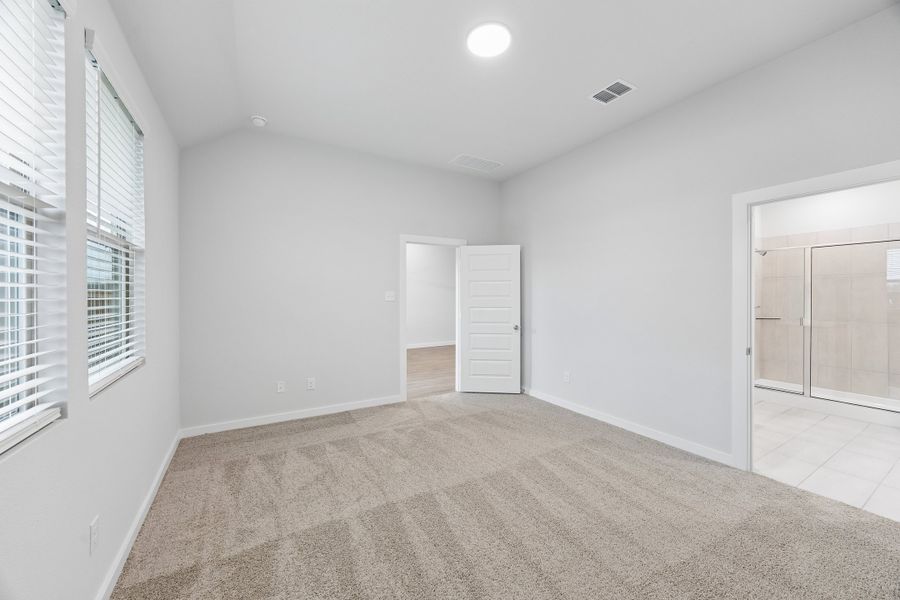 Primary Suite in the Cedar home plan by Trophy Signature Homes – REPRESENTATIVE PHOTO