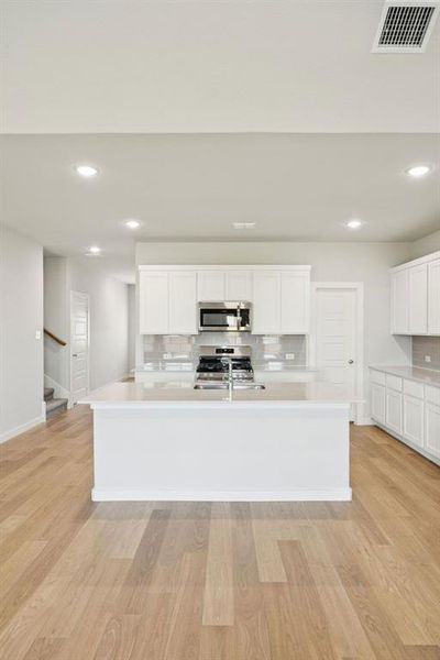Kitchen in the Masters home plan by Trophy Signature Homes – REPRESENTATIVE PHOTO