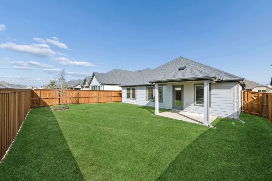 Covered Patio in the Emmy II home plan by Trophy Signature Homes - REPRESENTATIVE PHOTO