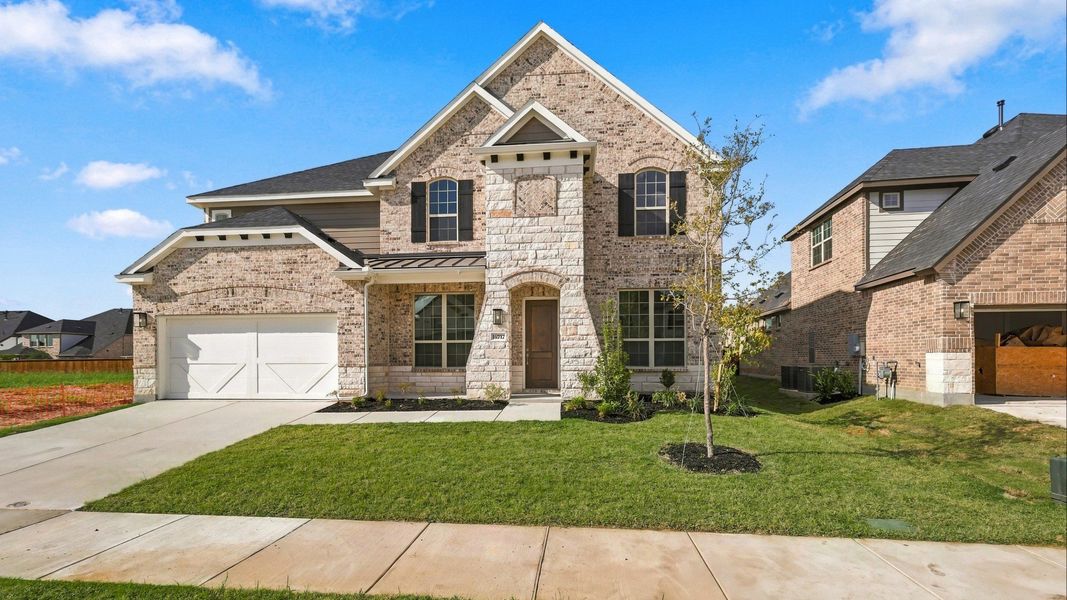 Front exterior of a new home in Green Meadows Classic, Celina, TX, highlighting curb appeal (Image 23).