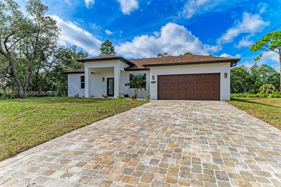 Front exterior of a new home in , North Port, FL, highlighting curb appeal (Image 25).