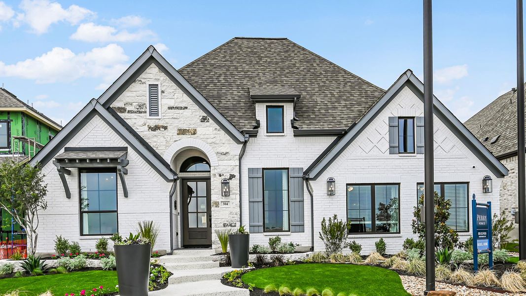 Front exterior of a new home in Trinity Falls, McKinney, TX, highlighting curb appeal (Image 20).