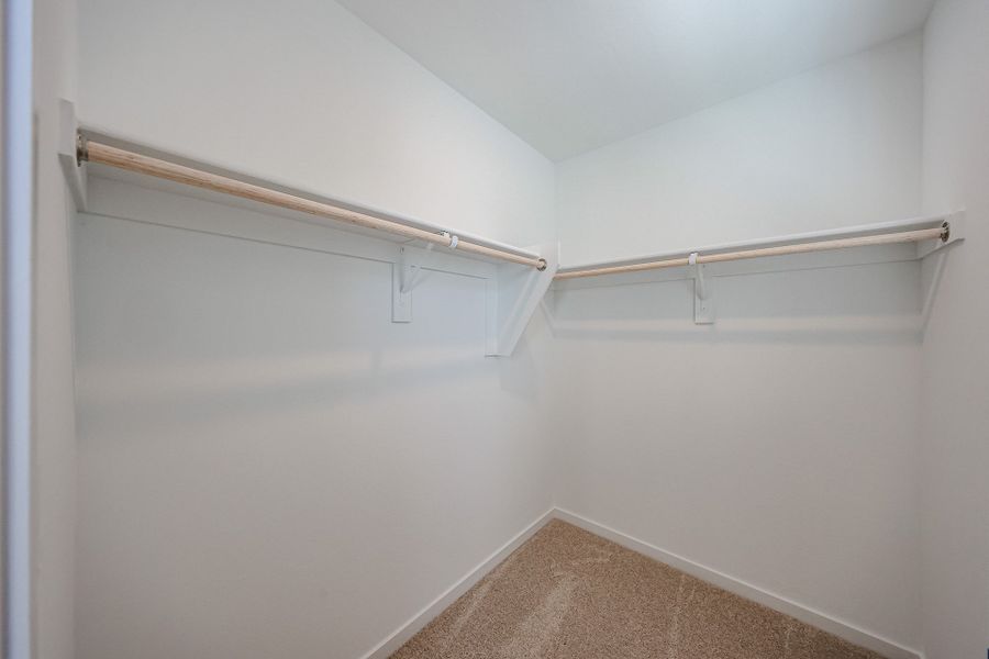 A white wall with a metal bar. A white wall with a metal bar.