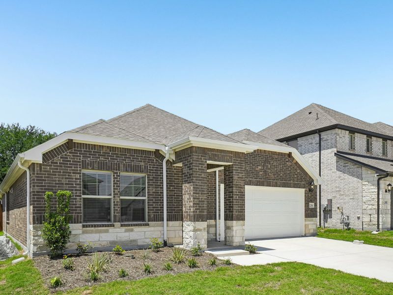 Front exterior of a new home in Stella Hills, Denton, TX, highlighting curb appeal (Image 2). Front exterior of a new home in Stella Hills, Denton, TX, highlighting curb appeal (Image 2).