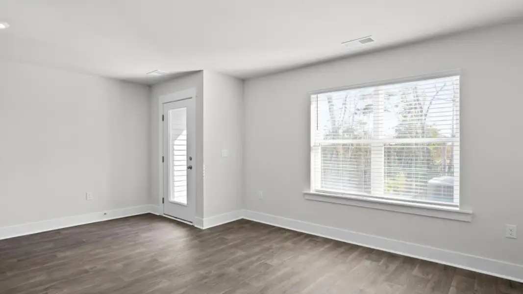 Spacious, unfurnished interior of a new home in The Townes at Cedar Hill Landing, Navassa (Image 14).