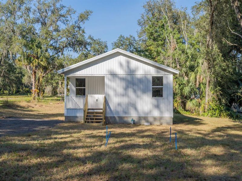 Exterior details and patio area of a home in , Fort McCoy (Image 18).
