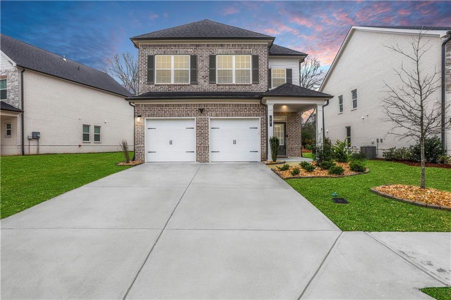 Front exterior of a new home in Graystone Village, Grayson, GA, highlighting curb appeal (Image 1). Front exterior of a new home in Graystone Village, Grayson, GA, highlighting curb appeal (Image 1).