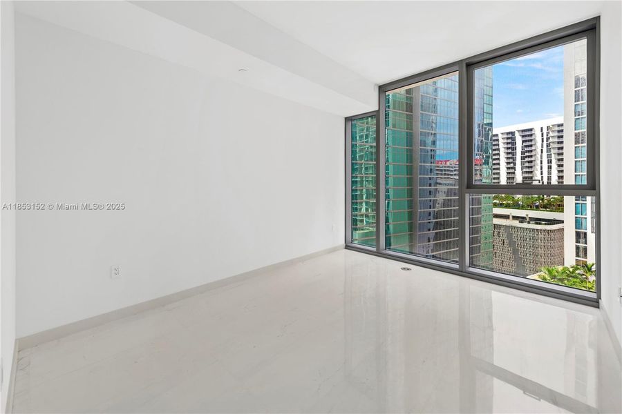 Spacious, unfurnished interior of a new home in Aston Martin Residences, Miami (Image 16).