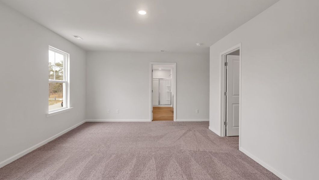 Representative unfurnished interior of a home built from the GLYNN by D.R. Horton in Grayson Park, Leland (Image 25).