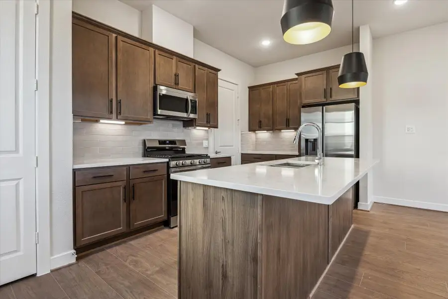 Kitchen – Previous work by the builder in the community, not representation of exact unit listed.