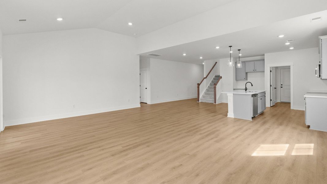 Open living room with vaulted ceilings, perfect for relaxing or entertaining at Chestnut Farms.
