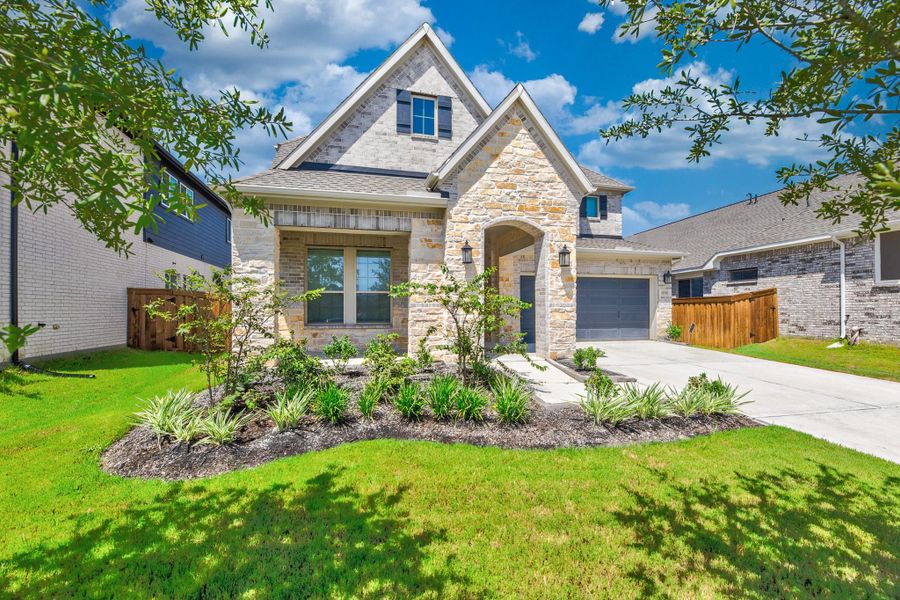 Front exterior of a new home in Dunham Pointe - Enclave Collection, Cypress, TX, highlighting curb appeal (Image 24).