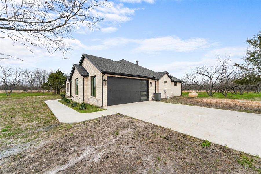 Front exterior of a new home in , Corsicana, TX, highlighting curb appeal (Image 21).