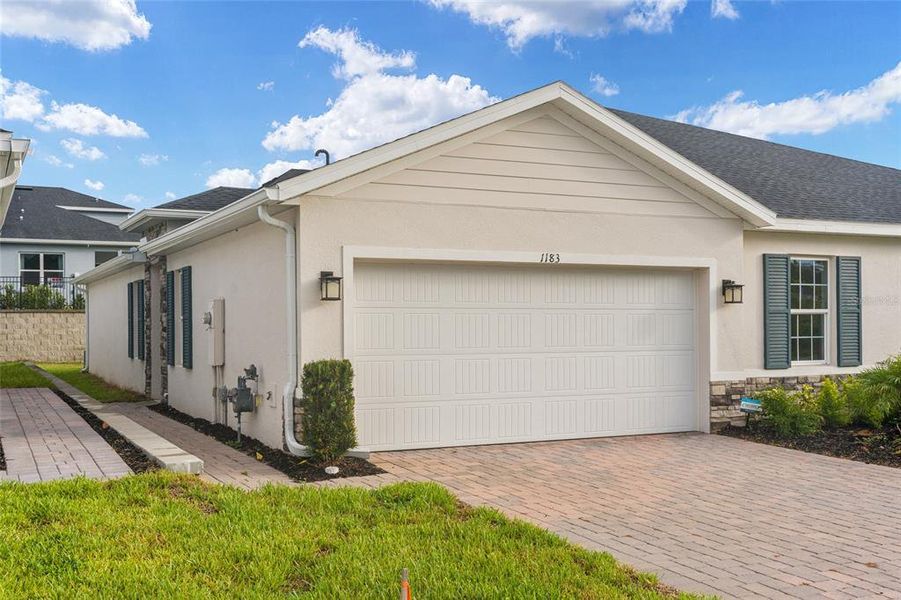Front exterior of a new home in , Lady Lake, FL, highlighting curb appeal (Image 32). Front exterior of a new home in , Lady Lake, FL, highlighting curb appeal (Image 32).