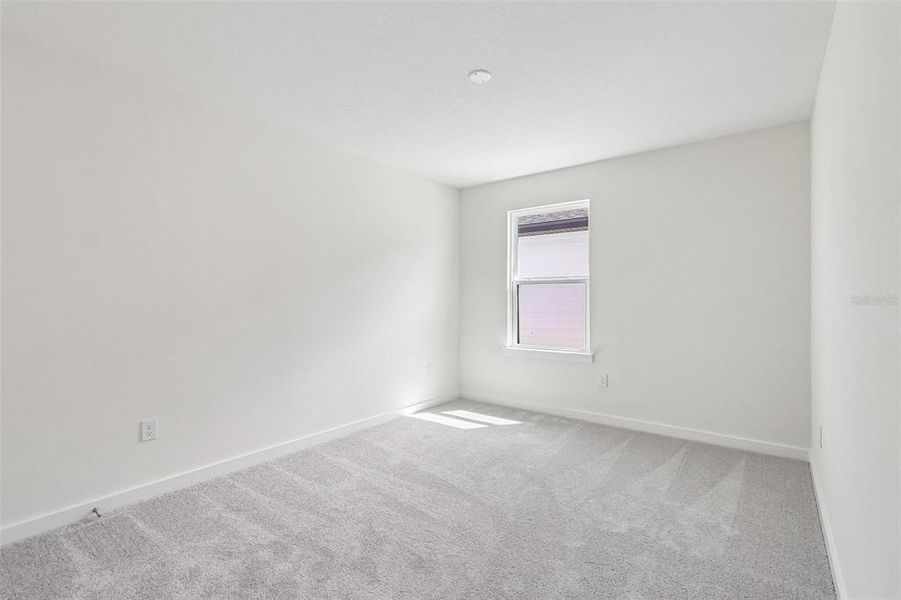 Spacious, unfurnished interior of a new home in Grasslands West, Lakeland (Image 14).
