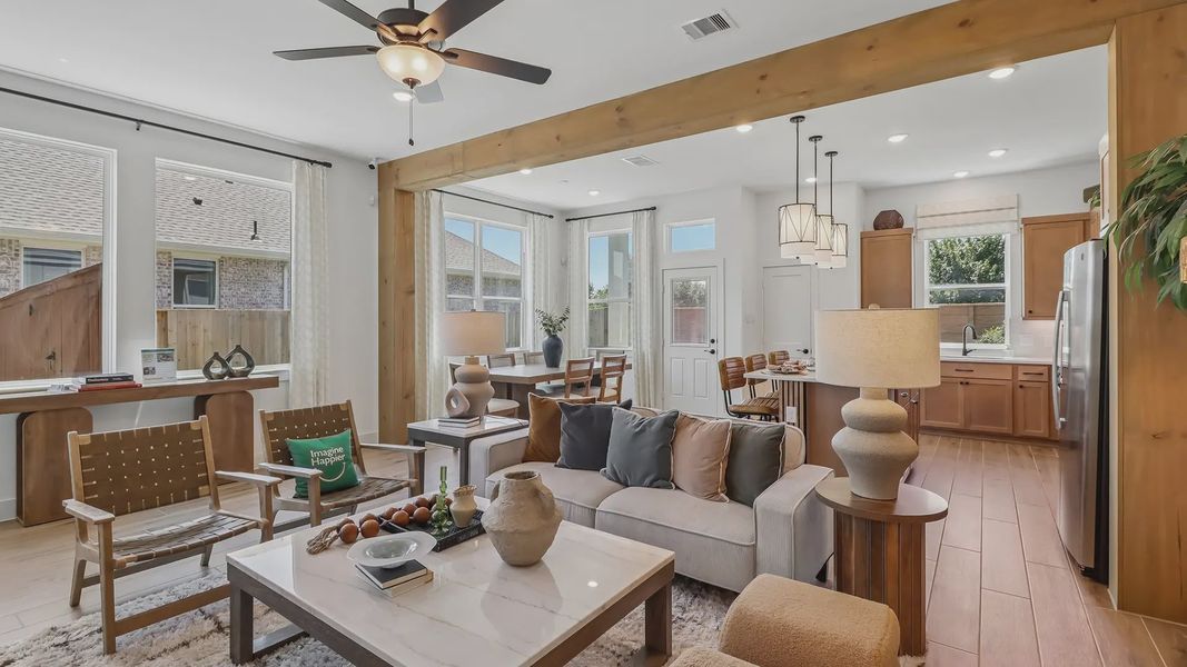Furnished interior view inside a new home in Meridiana Chateau, Manvel (Image 6).