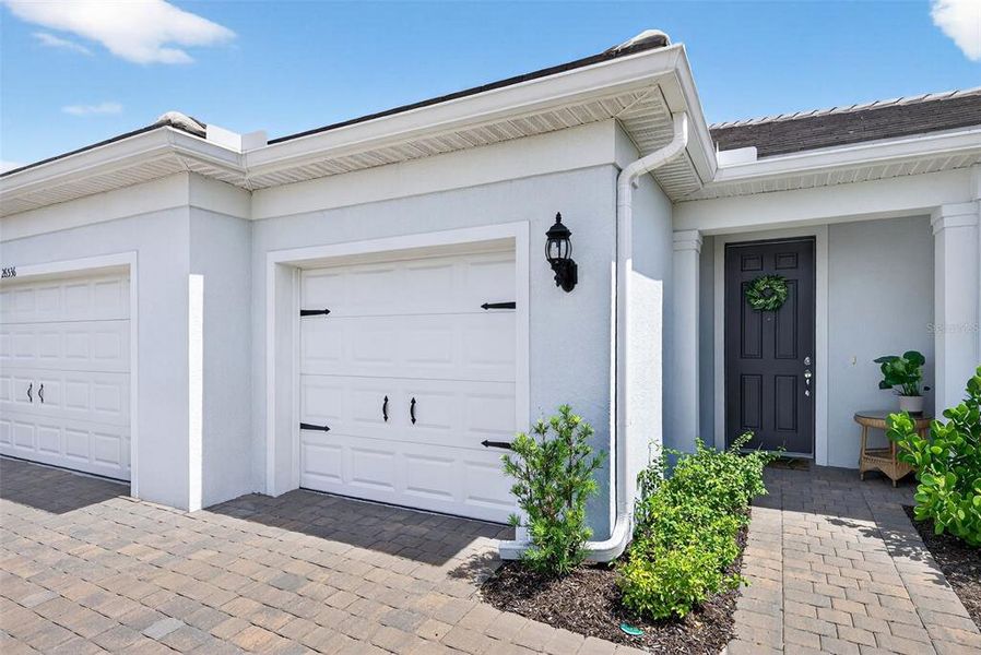 Front exterior of a new home in , Englewood, FL, highlighting curb appeal (Image 24). Front exterior of a new home in , Englewood, FL, highlighting curb appeal (Image 24).