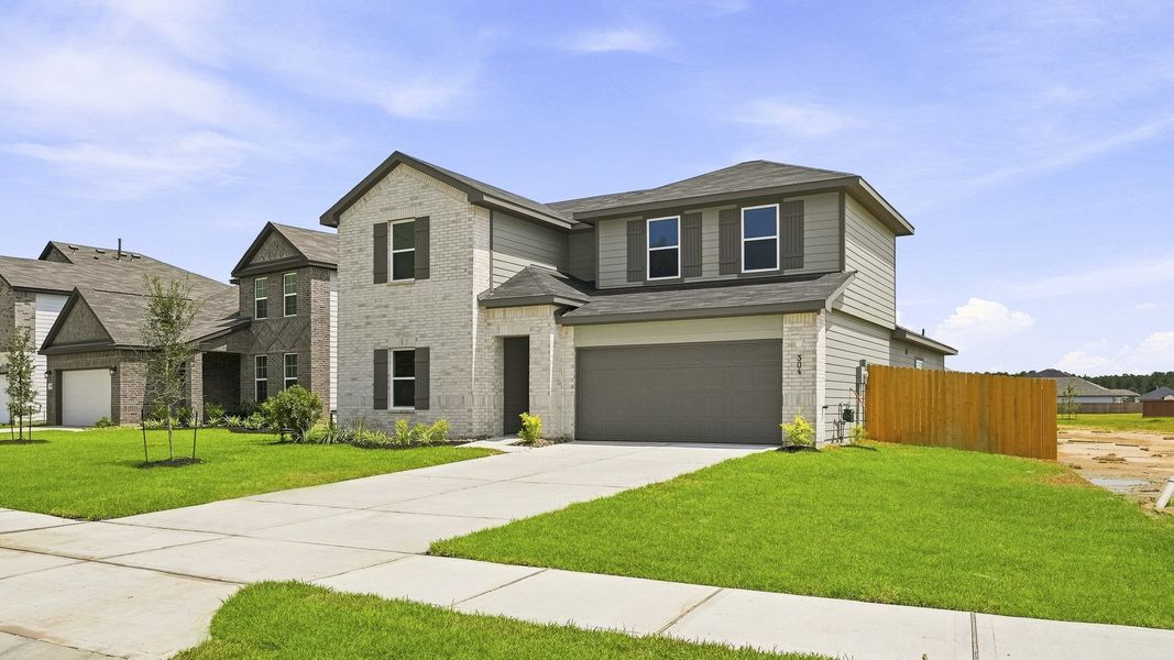 Front exterior of a new home in Maple Woods, Hockley, TX, highlighting curb appeal (Image 2). Front exterior of a new home in Maple Woods, Hockley, TX, highlighting curb appeal (Image 2).