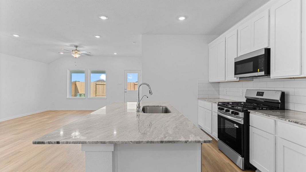 Furnished interior view inside a new home in Caldwell Crossing, Iowa Colony (Image 5).
