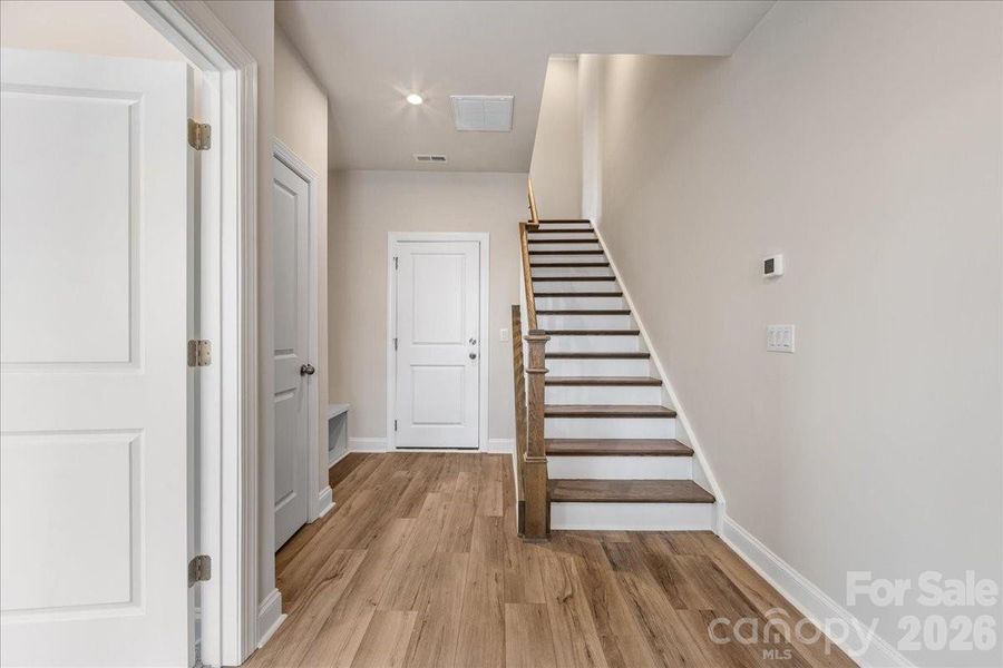 Foyer with Oak Box Stairs and Drop Zone