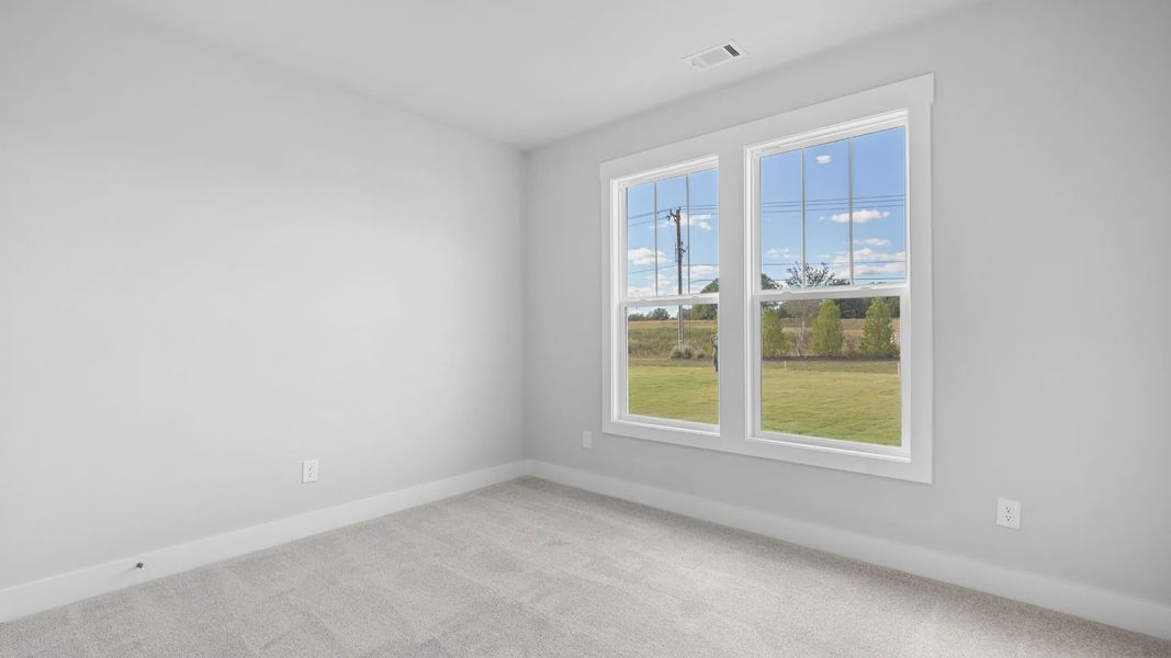 2 story single family home, all white, bedroom