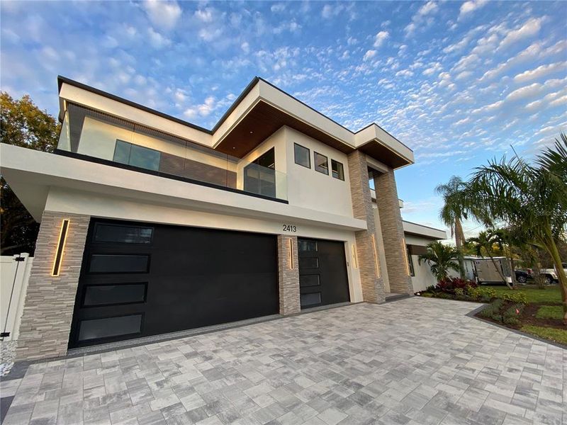 Front exterior of a new home in , Sarasota, FL, highlighting curb appeal (Image 2).