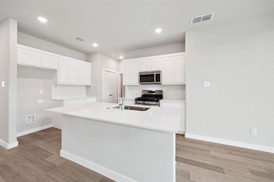 Kitchen in the Mesquite home plan by Trophy Signature Homes REPRESENTATIVE PHOTO Kitchen in the Mesquite home plan by Trophy Signature Homes REPRESENTATIVE PHOTO