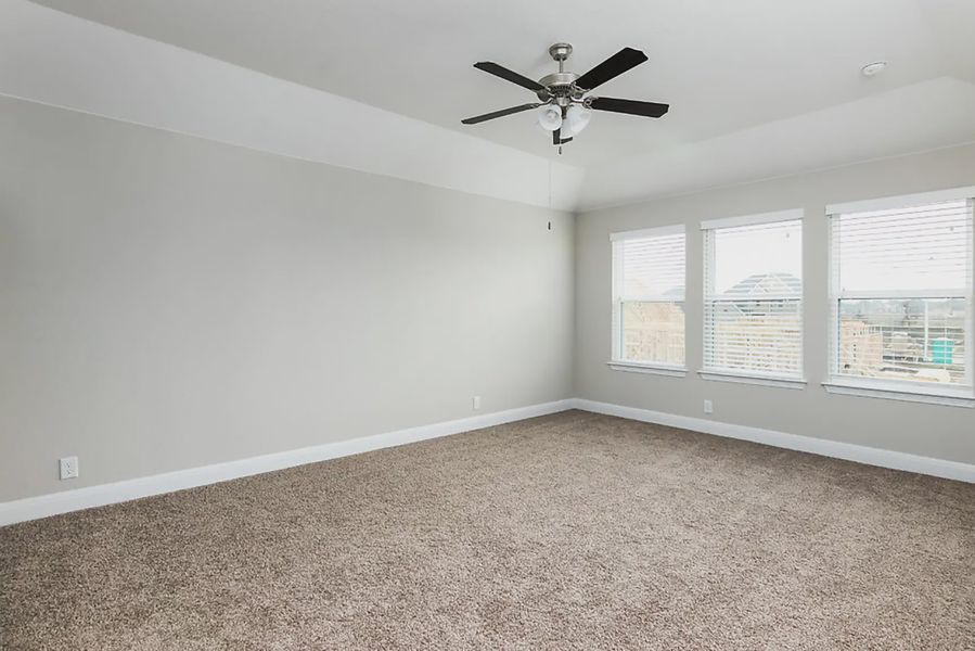 Representative unfurnished interior of a home built from the Finnigan by Chesmar Homes in Buffalo Crossing, Cibolo (Image 10).