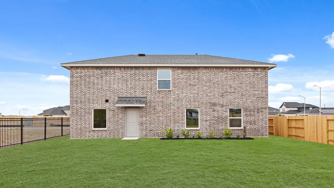 Exterior details and patio area of a home in Sunterra, Katy (Image 3).