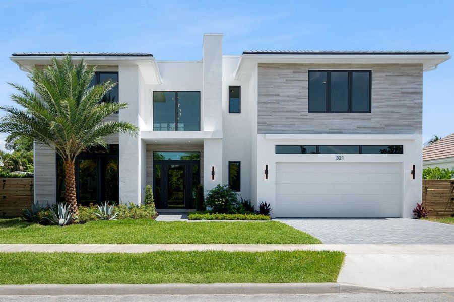 Front exterior of a new home in , West Palm Beach, FL, highlighting curb appeal (Image 20). Front exterior of a new home in , West Palm Beach, FL, highlighting curb appeal (Image 20).