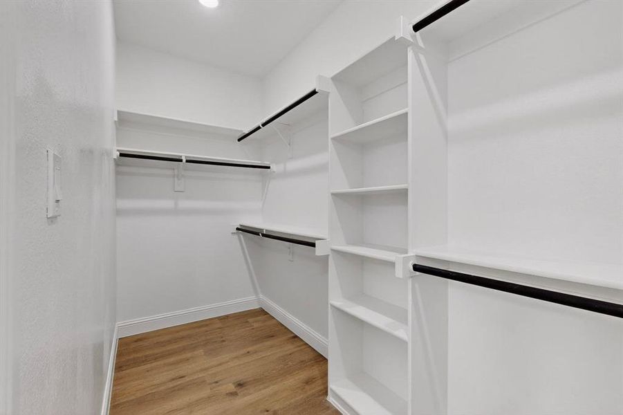 Walk in closet featuring light wood-type flooring