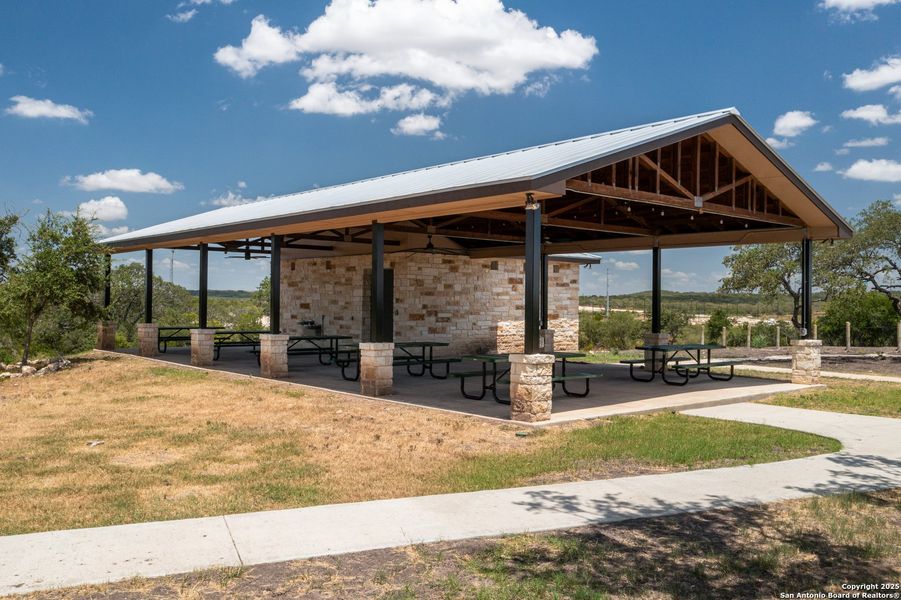 Front exterior of a new home in Hunters Ranch, San Antonio, TX, highlighting curb appeal (Image 24).