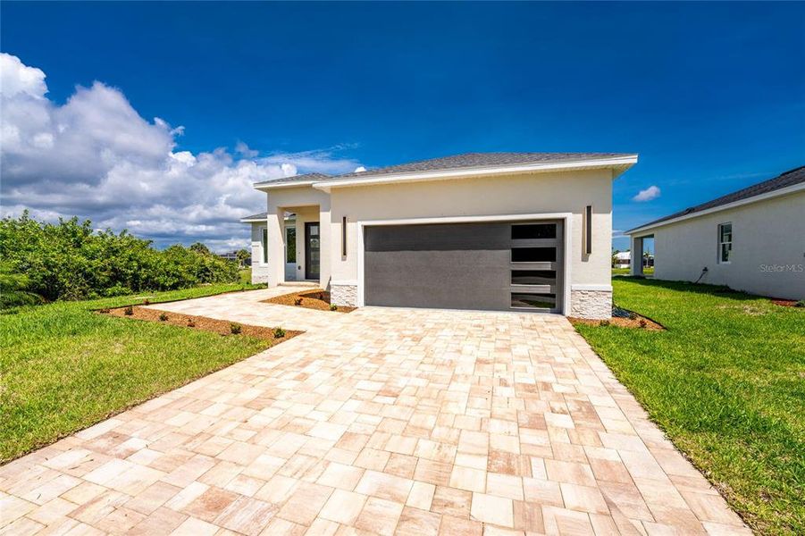 Front exterior of a new home in , Rotonda West, FL, highlighting curb appeal (Image 29).