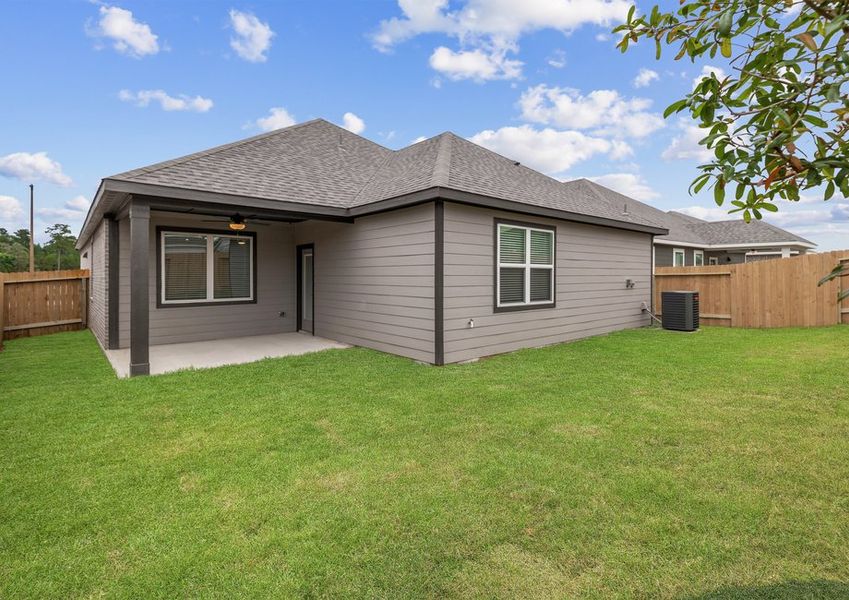 Covered back patio and a fully fenced yard Covered back patio and a fully fenced yard