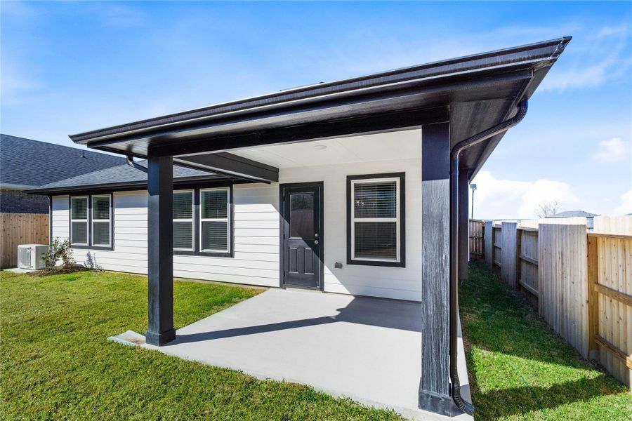 The spacious covered patio offers a tranquil outdoor retreat, perfectly designed for savoring your quiet morning coffee or unwinding during peaceful evening relaxation.