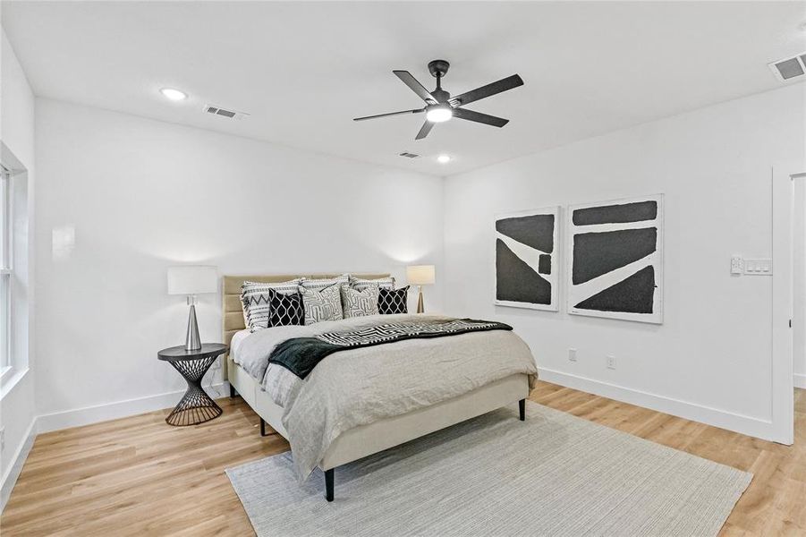 Bedroom featuring light hardwood / wood-style flooring and ceiling fan