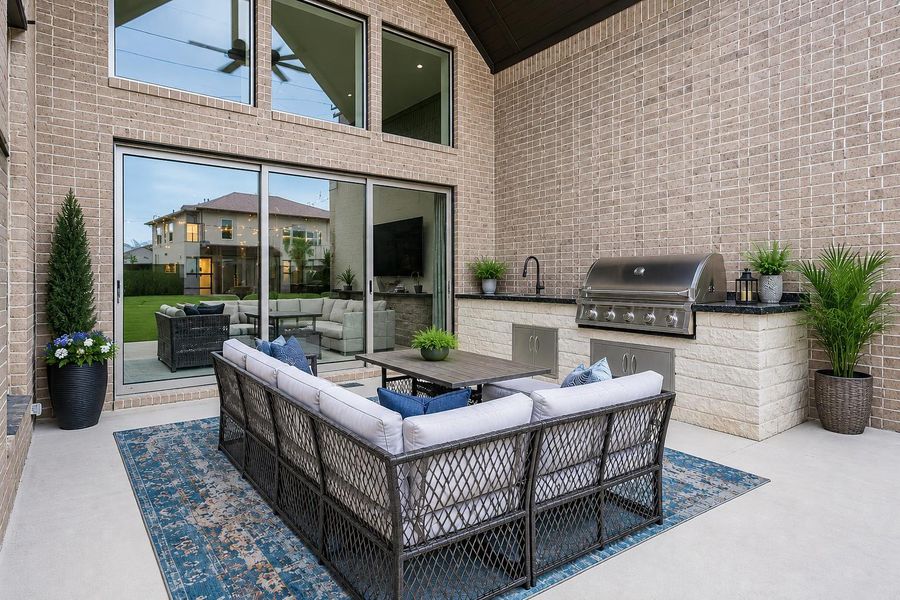 Patio has high vaulted ceiling with fan and recessed lighting -Photo has been virtually altered to help viewer with perspective