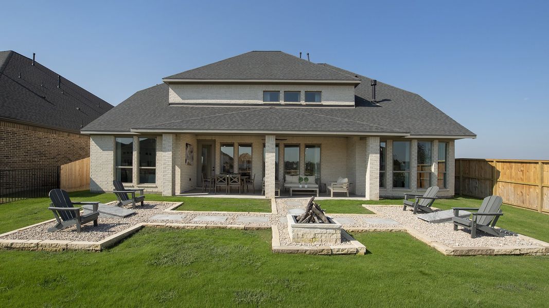 Front exterior of a new home in Cross Creek Ranch 65', Fulshear, TX, highlighting curb appeal (Image 2). Front exterior of a new home in Cross Creek Ranch 65', Fulshear, TX, highlighting curb appeal (Image 2).