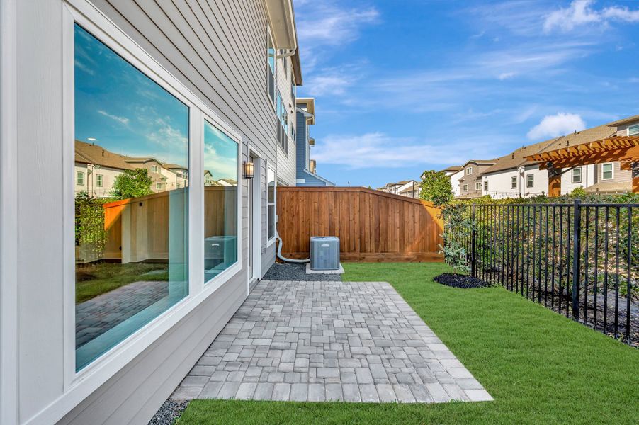 Exterior details and patio area of a home in Retreat at Oak Park, Houston (Image 3).