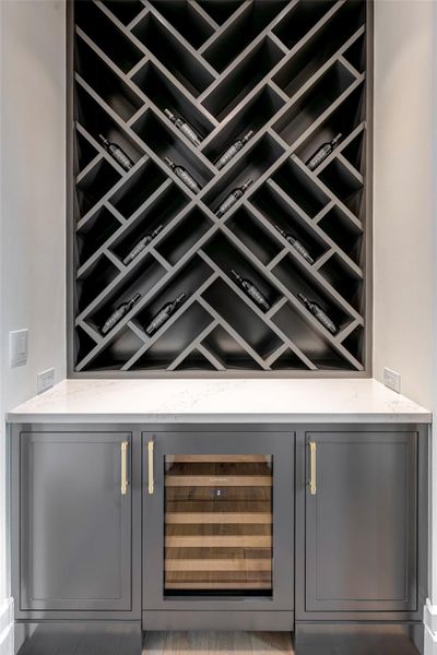 Butlers pantry has wine storage and a beverage frig.