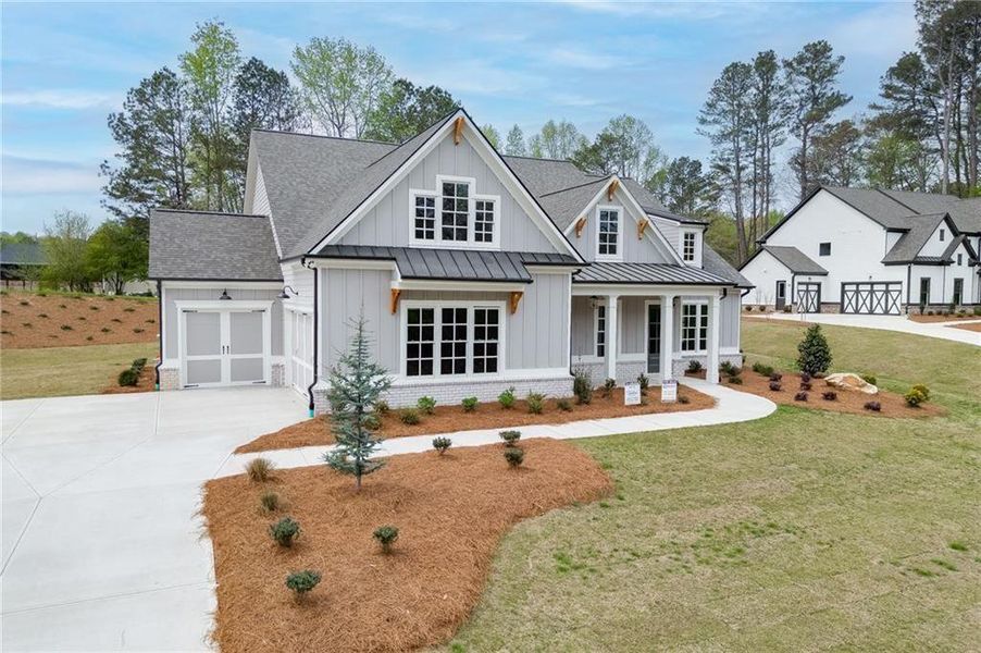 Front exterior of a new home in , Cumming, GA, highlighting curb appeal (Image 25).